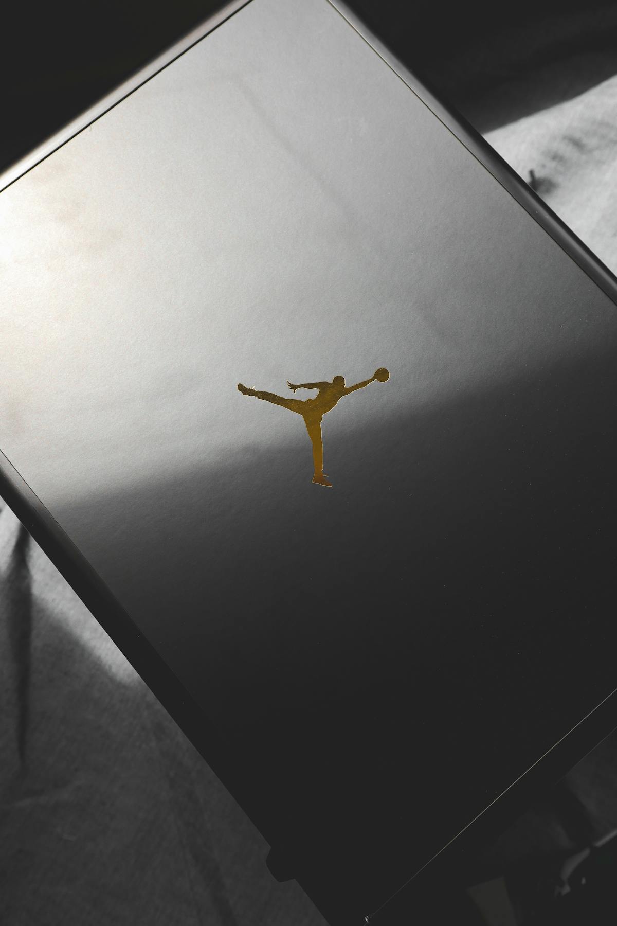 Wrestling championship belt resting on the ring apron under arena lights