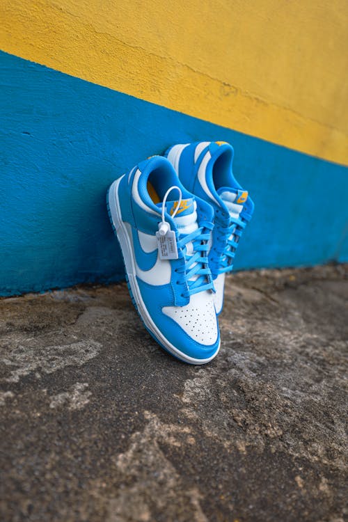 Free Blue Jordans leaning on Wall  Stock Photo