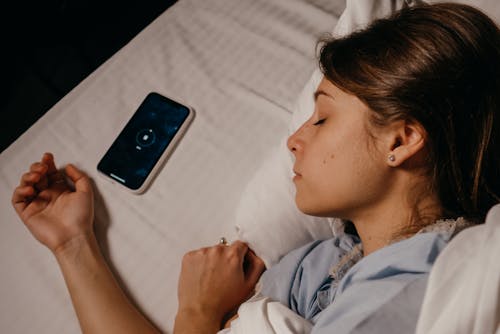 Phone beside an Asleep Woman 