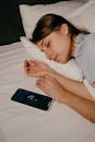 Phone beside an Asleep Woman