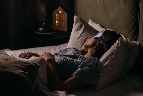 Free Asleep Woman wearing Eye Mask Stock Photo