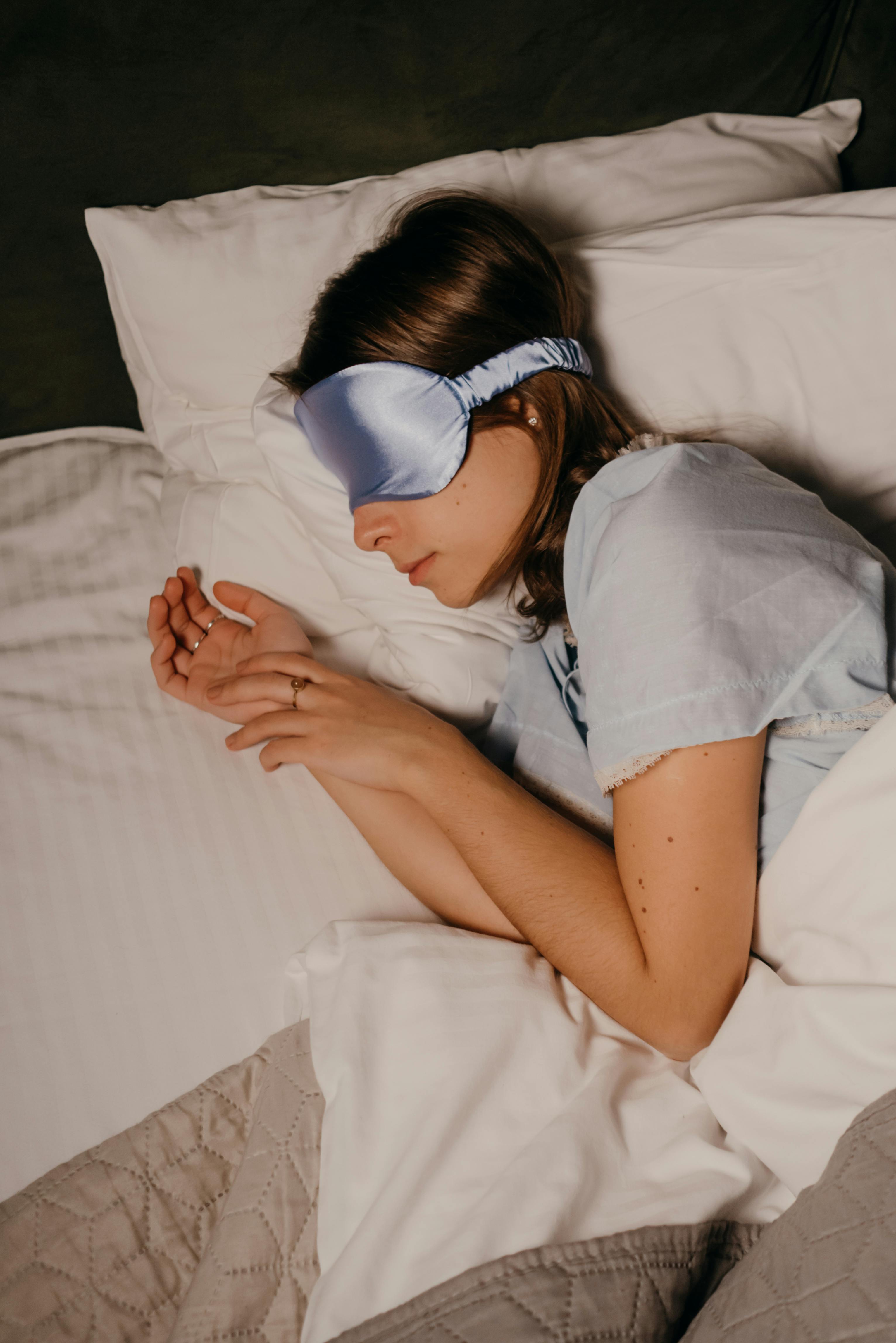 asleep woman wearing eye mask