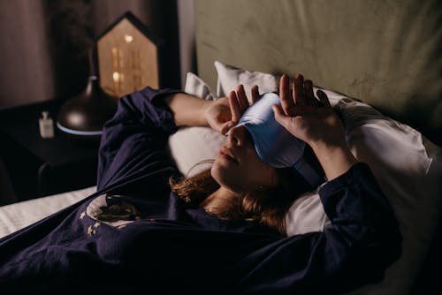 Free A Woman Wearing a Sleep Mask Stock Photo