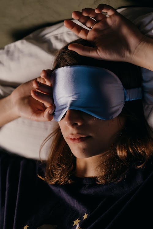 Free Woman Using a Sleep Mask Stock Photo