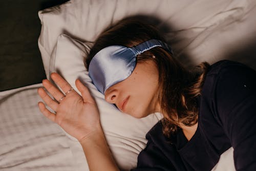 Free A Woman Wearing a Sleep Mask Stock Photo