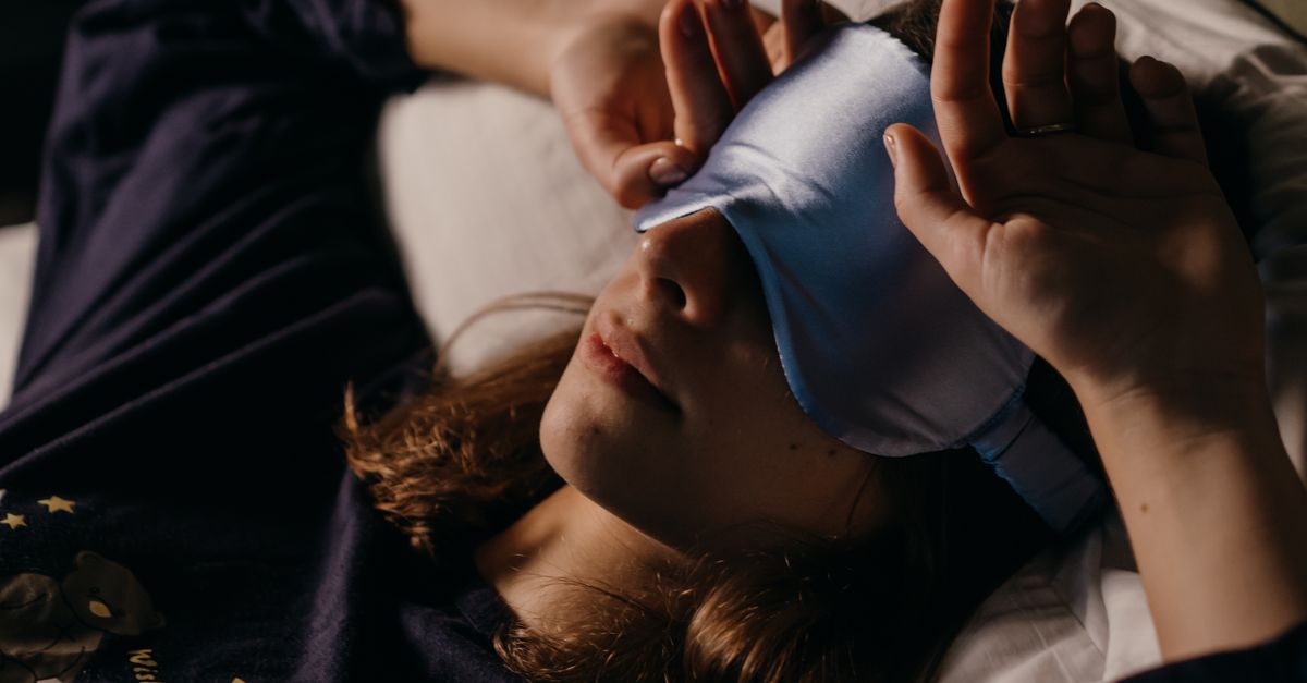 A woman resting at home wearing a sleep mask for a cozy afternoon nap. - Evidence evidence guide for Glycine Sleep Meta-analysis: What the Evidence Says