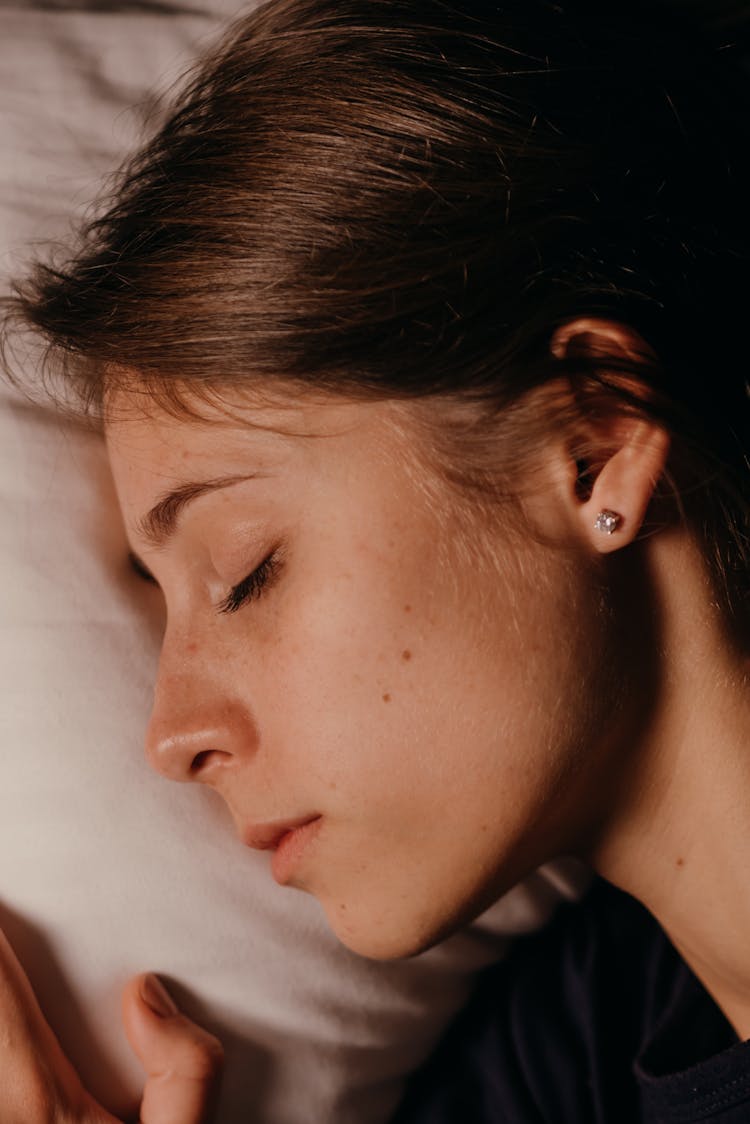 A Side View Of A Woman Sleeping In Close-up Shot
