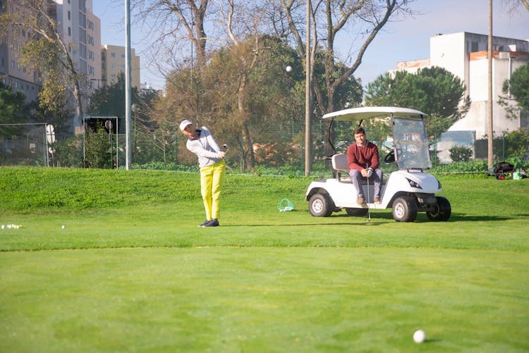 Man And Woman Playing Golf