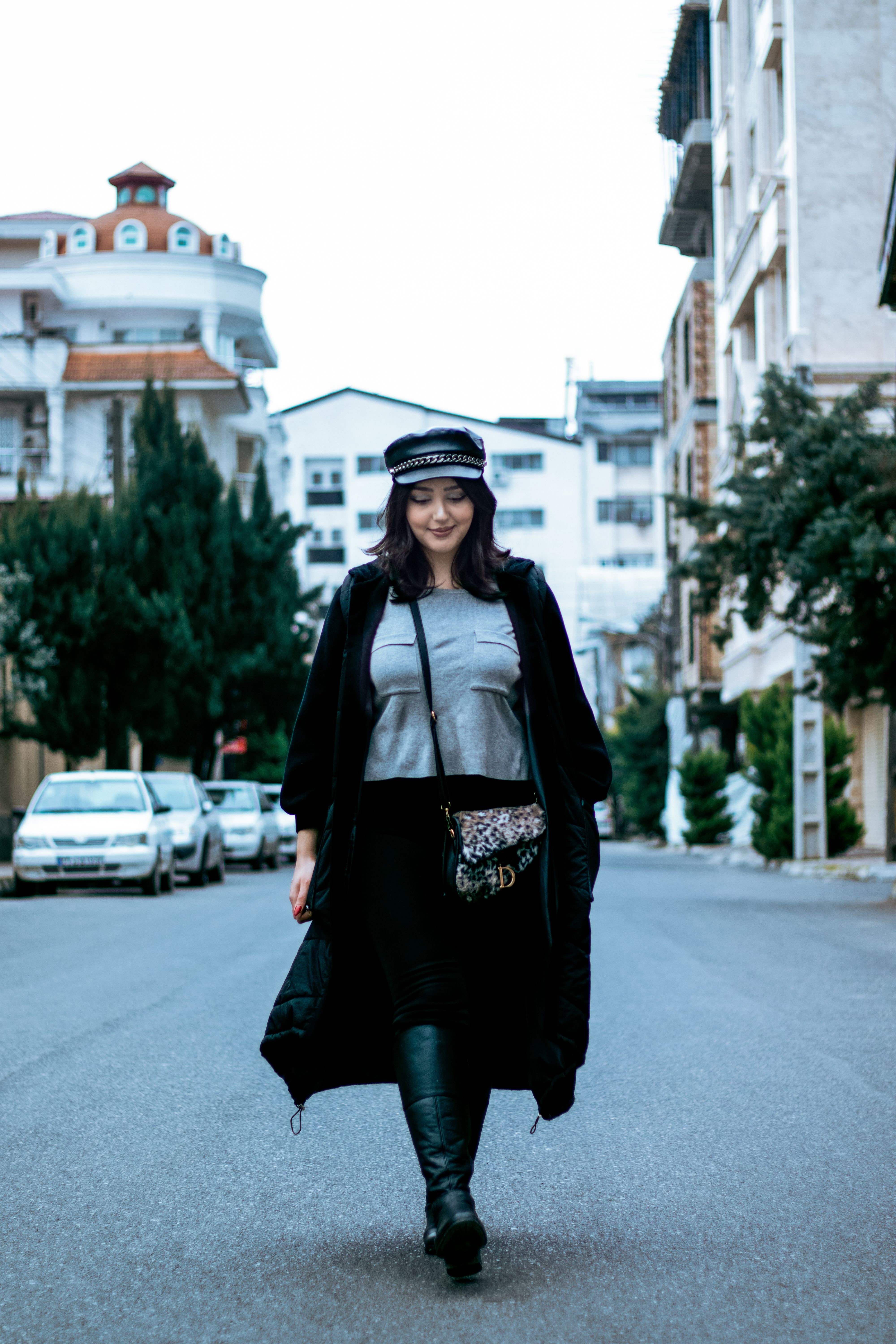 A Woman in Black Coat Walking on the Street · Free Stock Photo