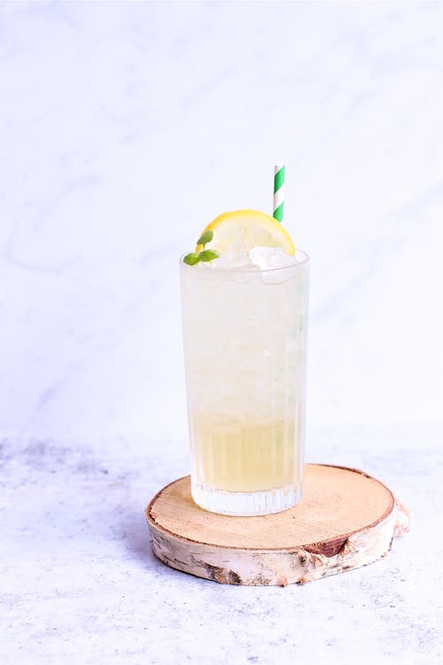 Delicious lemonade with lemon slice and straw