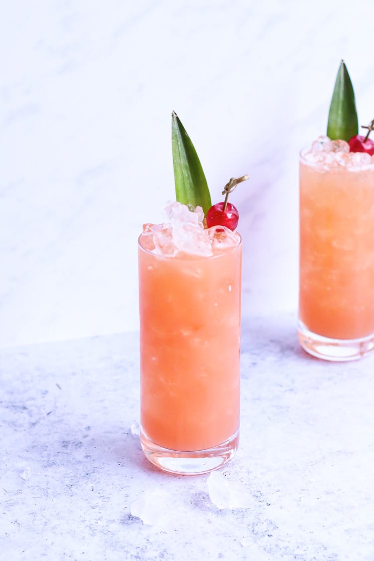 Glasses Of Fresh Icy Cocktails On Marble Table