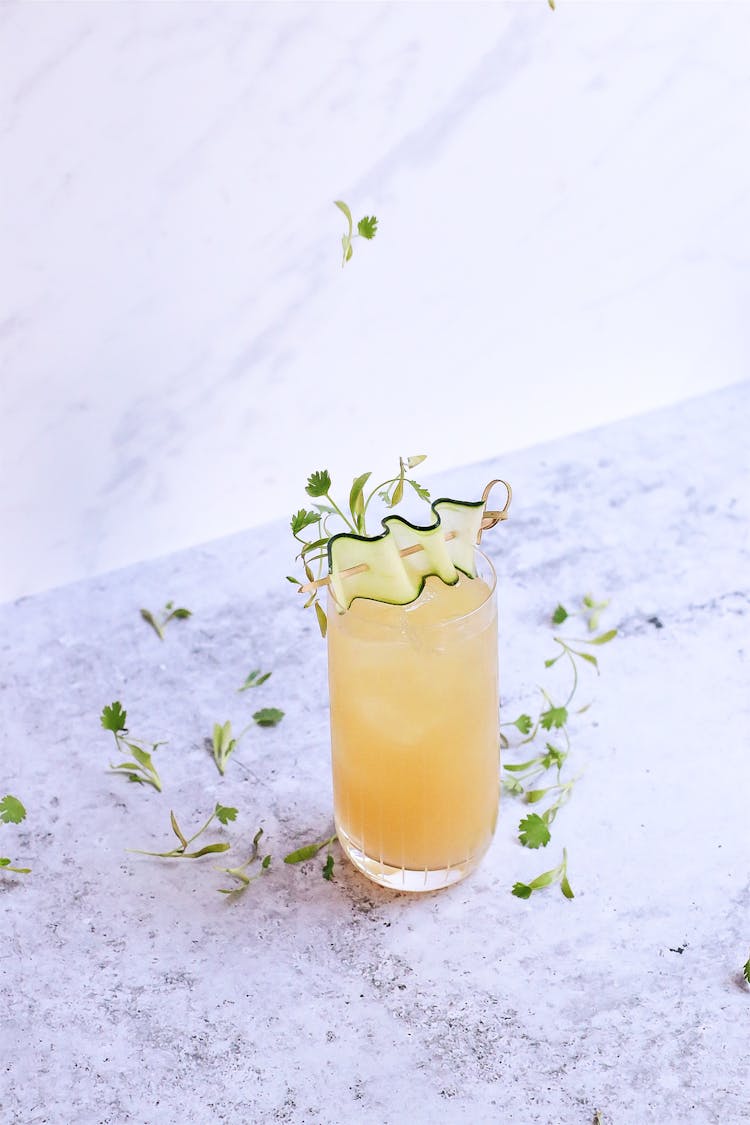 Glass Of Sour Ginger Cocktail On Marble Table