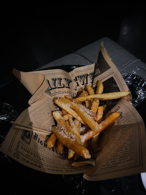 Free Fries on Newspaper Stock Photo