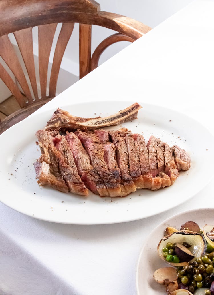 Appetizing Cut Ribeye Steak Served On Restaurant Table