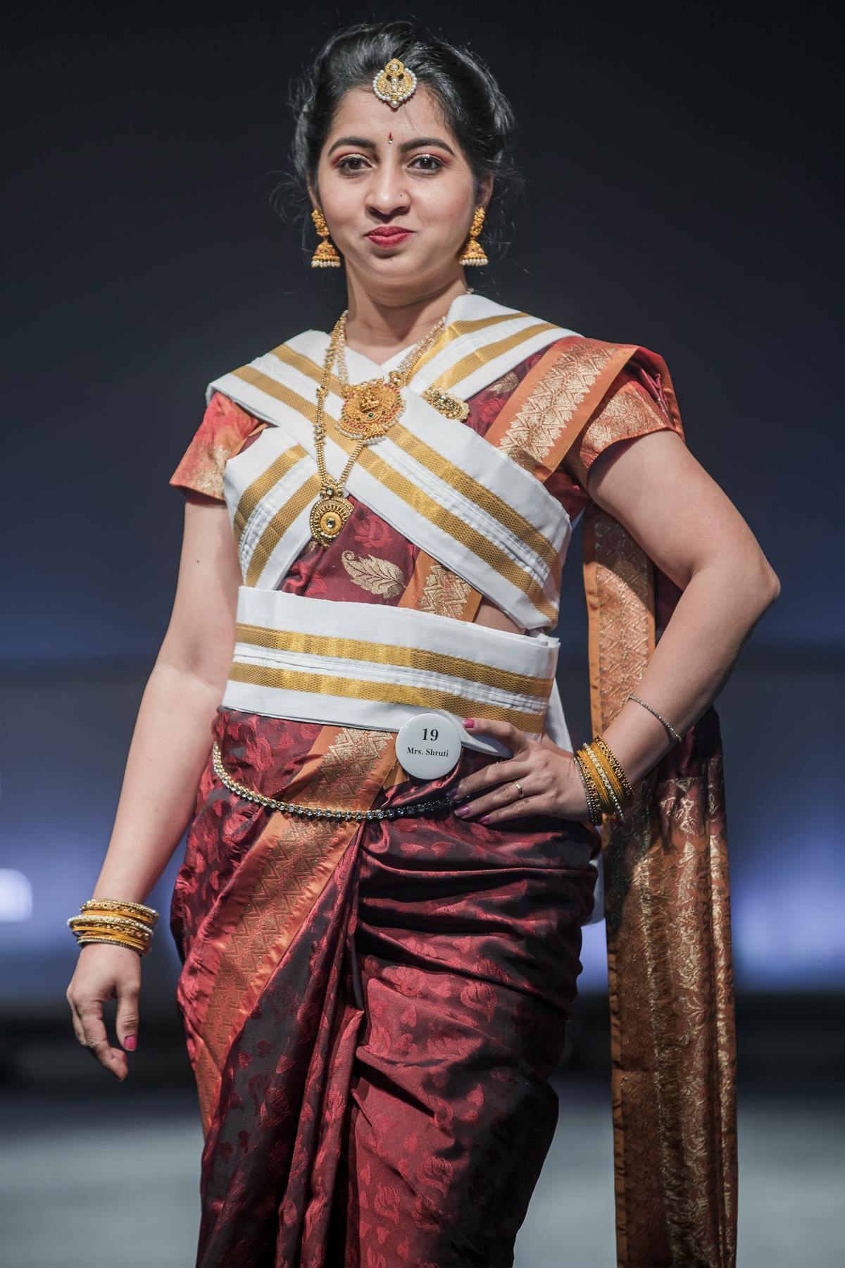 A bowl of vegetable soup and whole-grain bread on a table