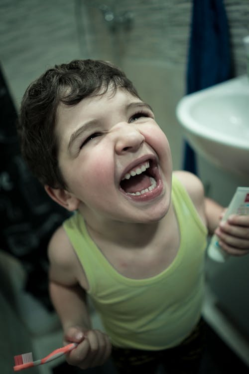 Free Excited boy preparing for cleaning teeth Stock Photo