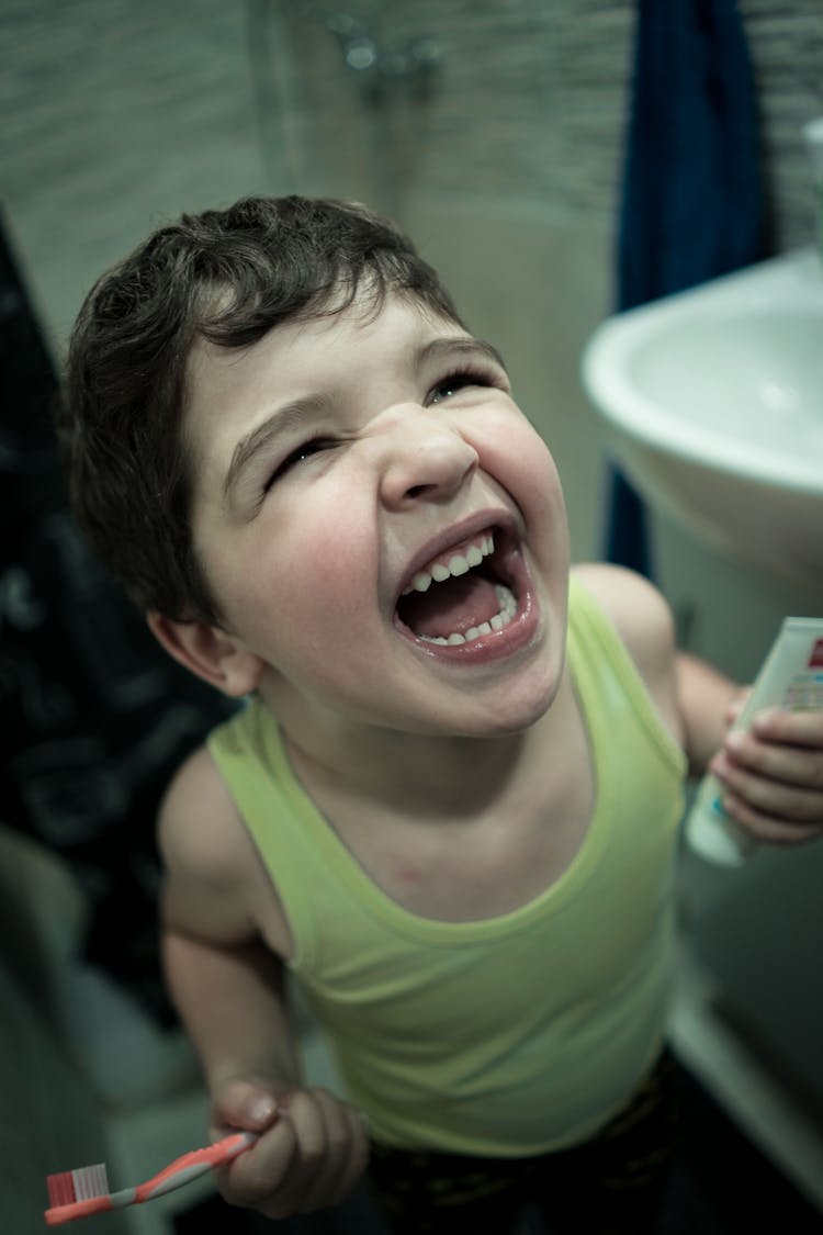 Excited Boy Preparing For Cleaning Teeth