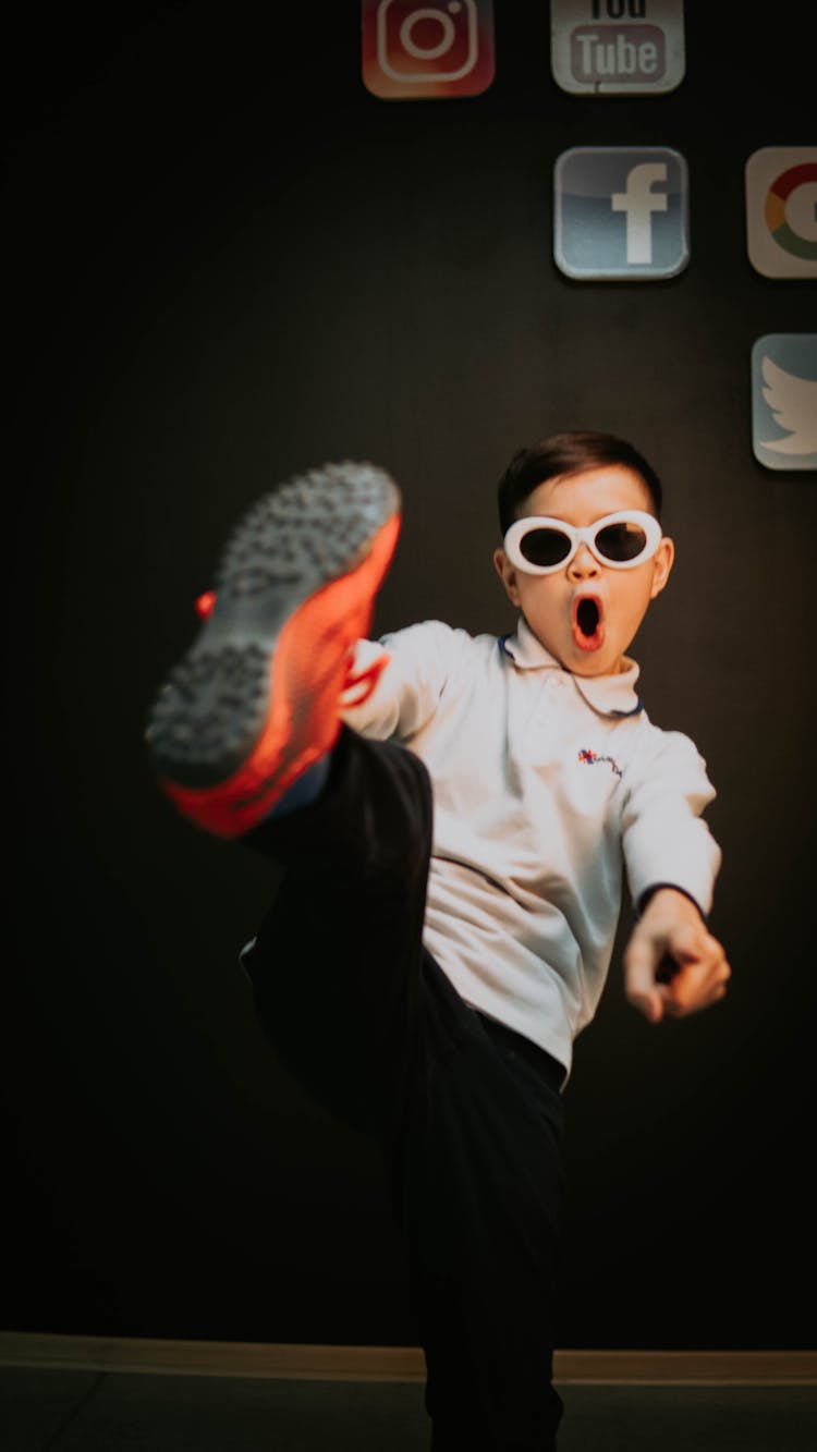 A Young Boy Wearing Sunglasses