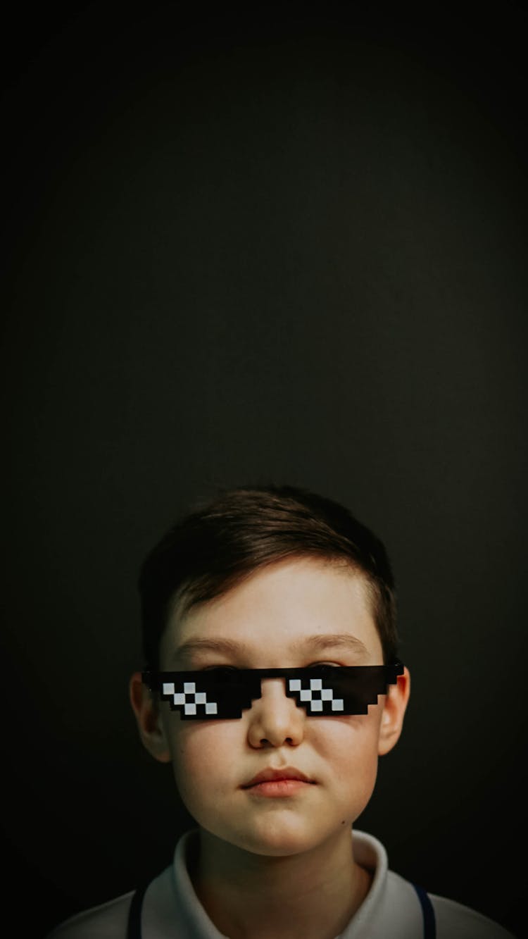 A Boy Wearing 8 Bit Pixel Sunglasses