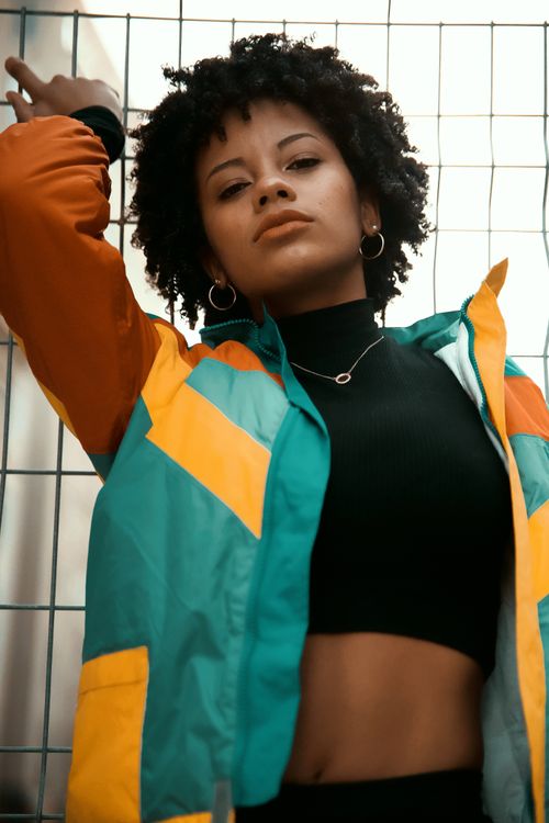 Free Portrait of a fashionable woman in Montreal, wearing a colorful jacket. Stock Photo