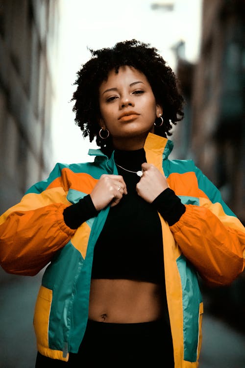 A Woman in Colorful Jacket Wearing Black Crop Top
