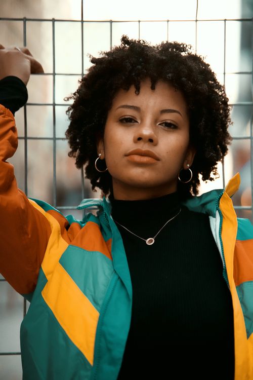 Free Portrait of a fashionable woman in Montreal with colorful jacket and jewelry. Stock Photo