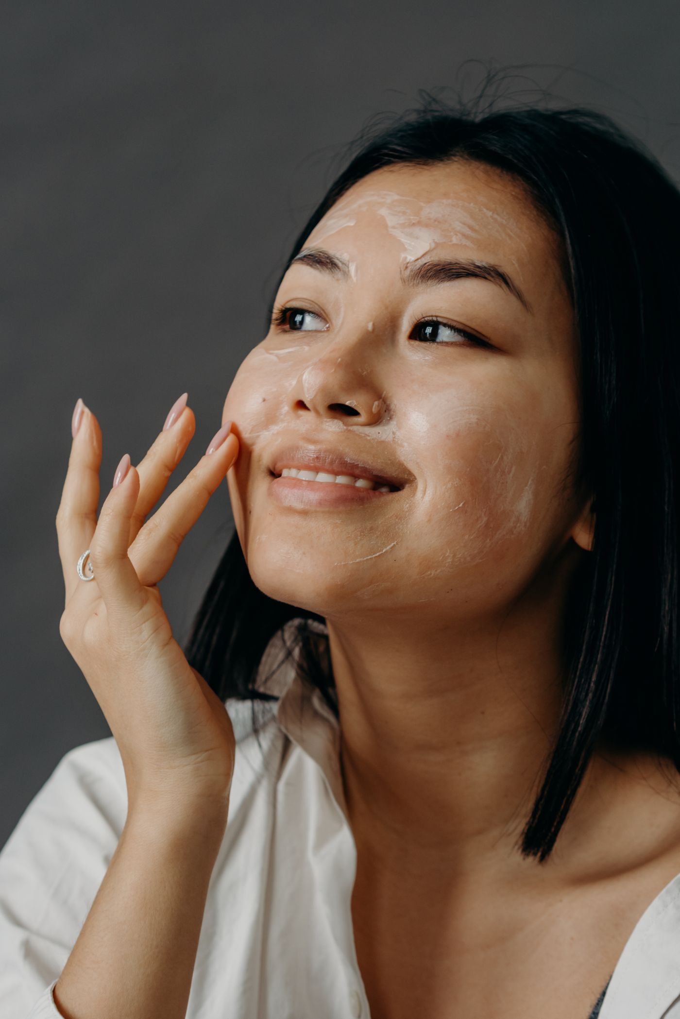 Woman applying face cream