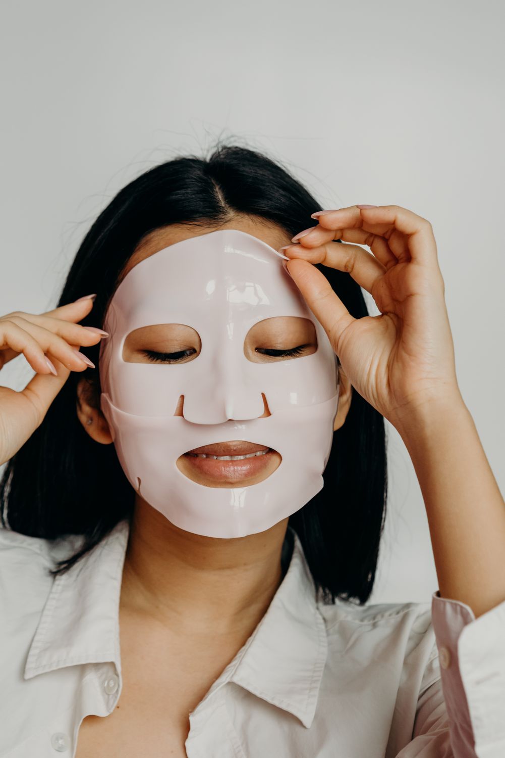 A Woman in White Long Sleeves with Mask on Her Face · Free Stock Photo