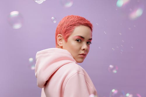 A Portrait of a Woman in a Pink Hoodie