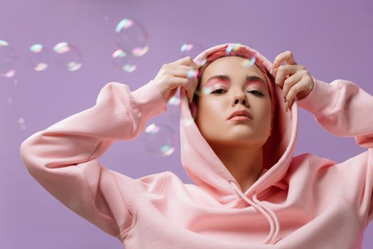 Portrait of a Woman in a Pink Hoodie