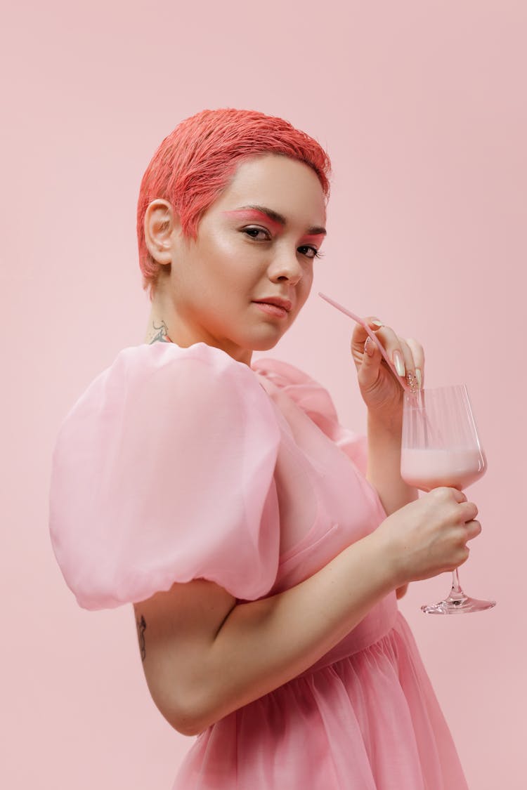 A Woman Drinking Strawberry Milkshake