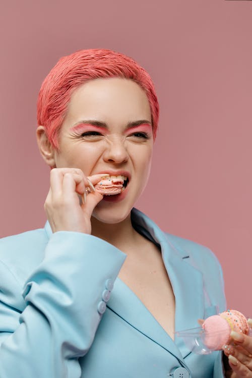 A Woman Eating French Macarons