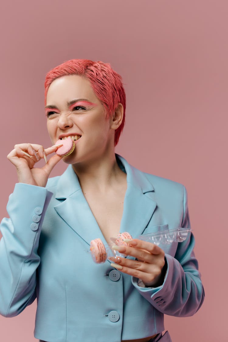 Woman In Blue Suit Eating Cookies