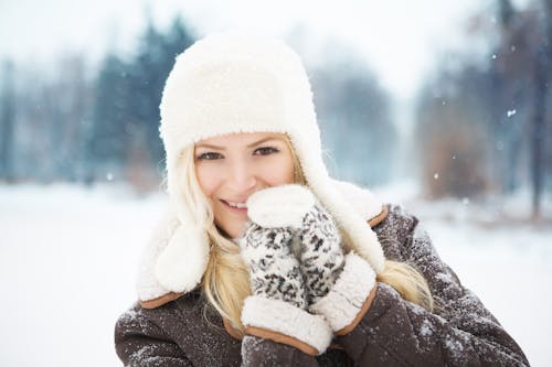 Free Woman in Brown Jacket Wearing White Beanie Hat Stock Photo