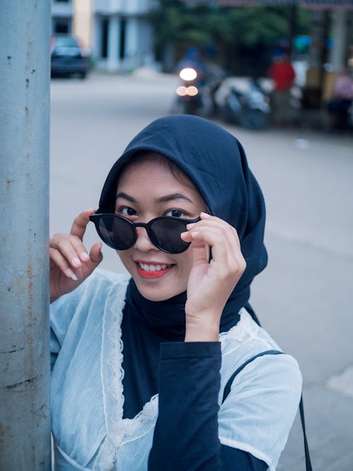 Woman in Blue Hijab and Black Sunglasses