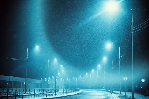 Highway at Night During Snowfall