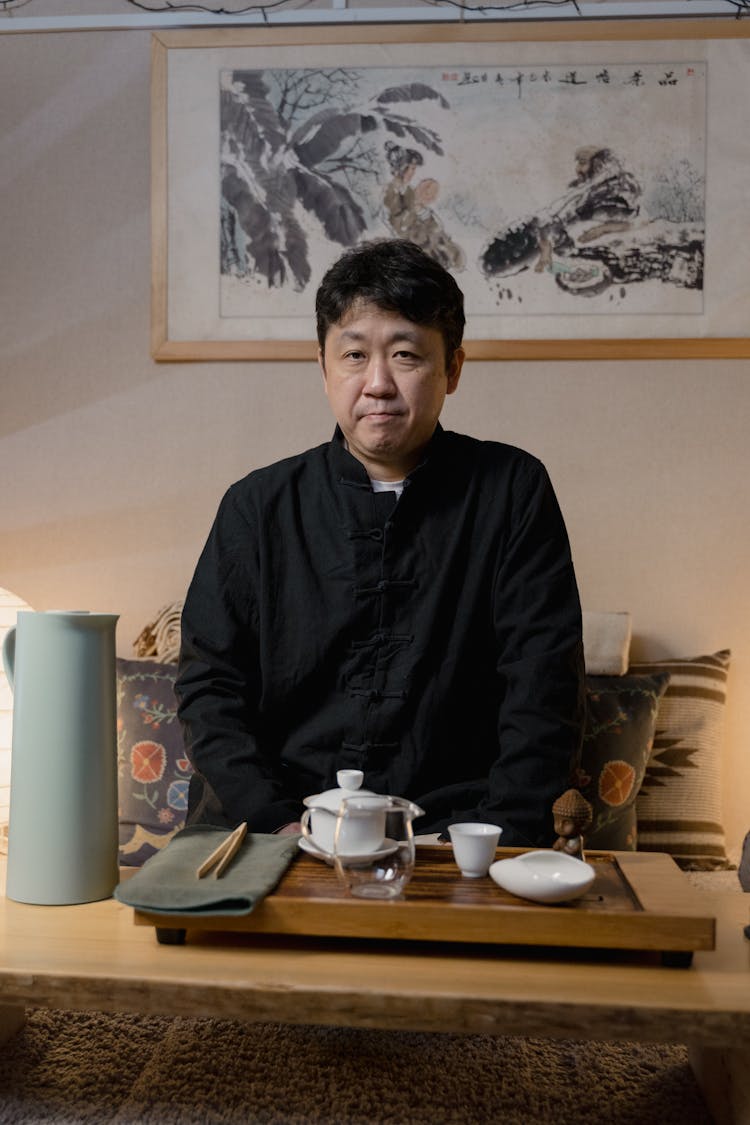 Man Holding Tea Ceremony In Tea Room