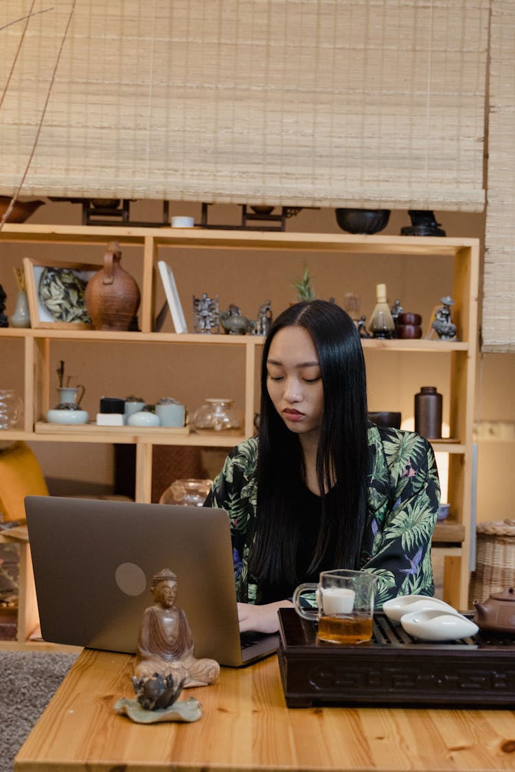 A Woman Using A Laptop