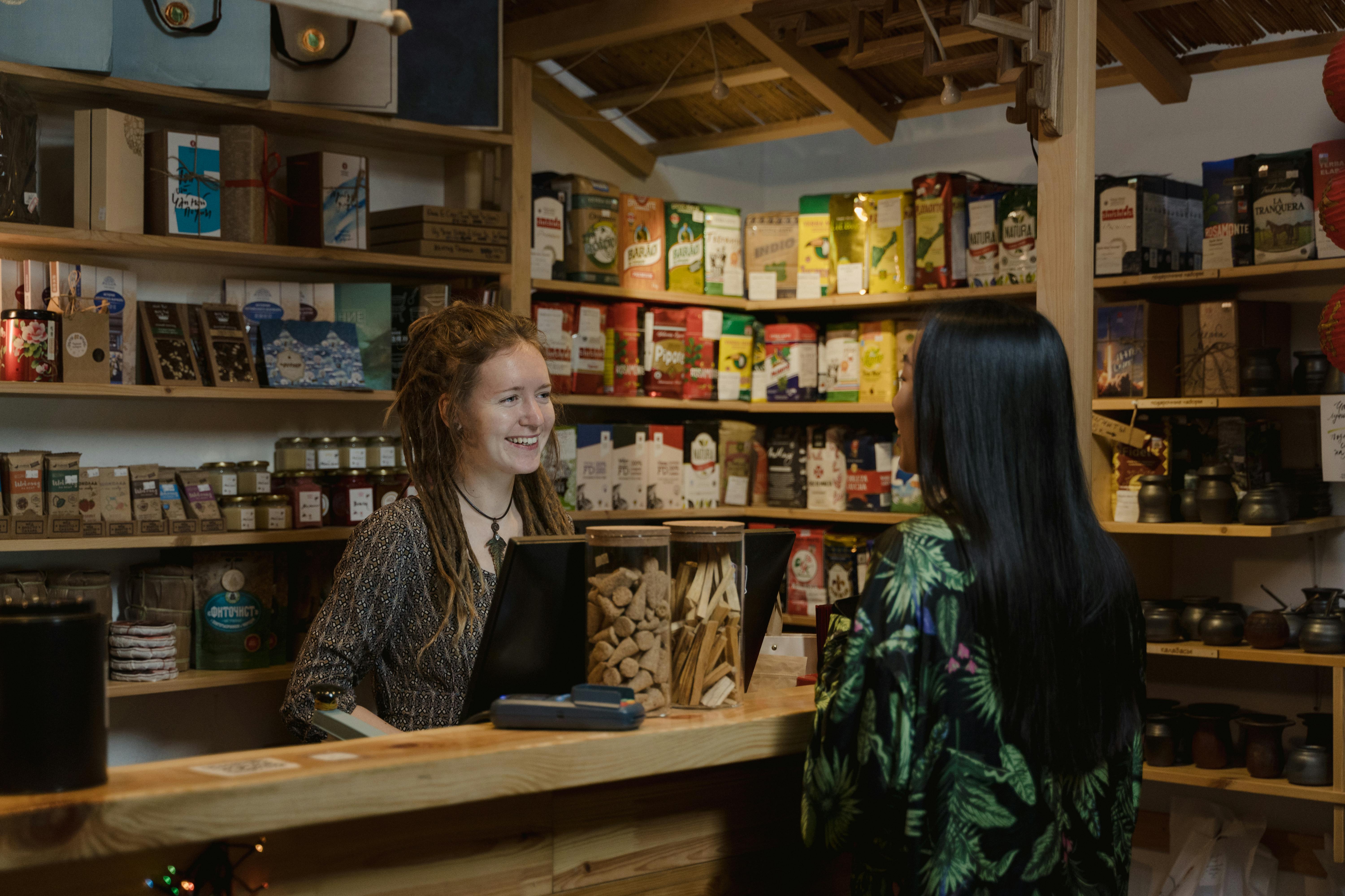 a woman talking to a customer