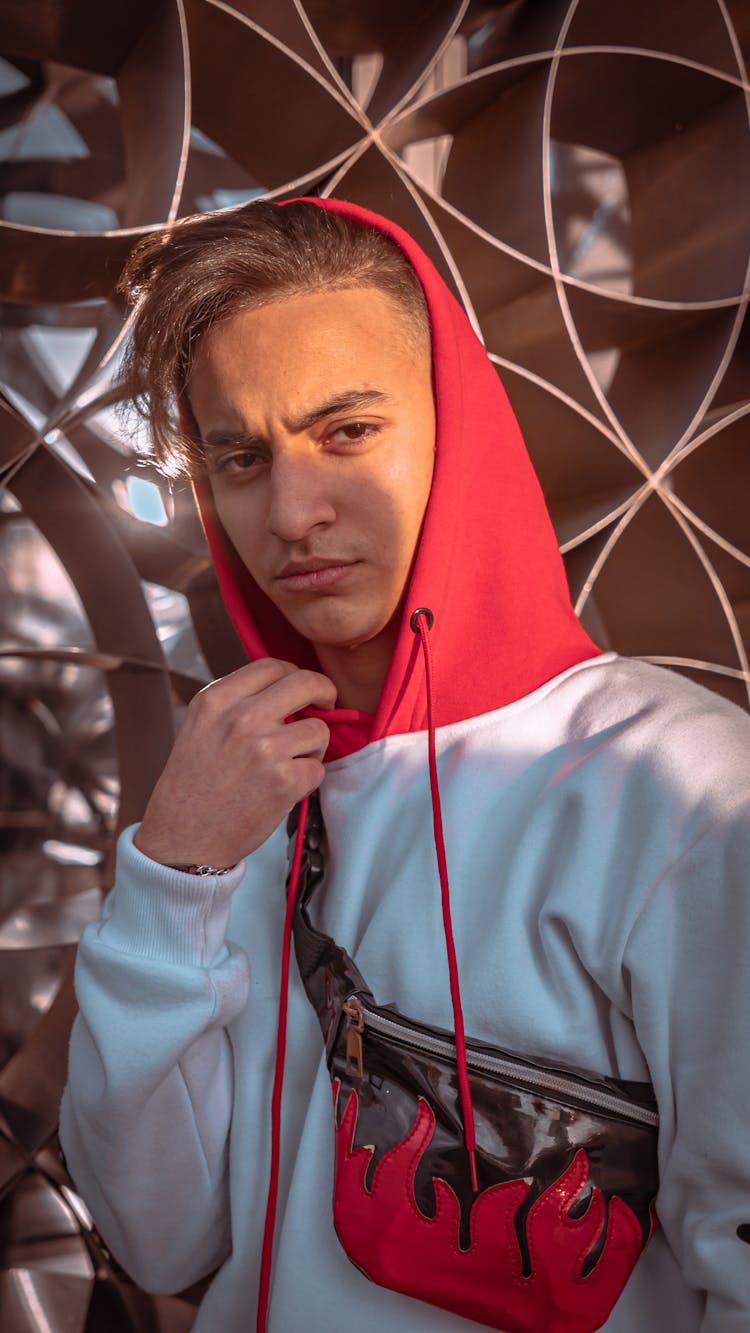 A Man Wearing White And Red Hoodie