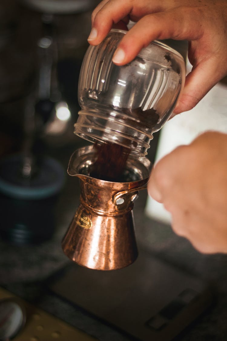 Crop Person Pouring Coffee In Cezve