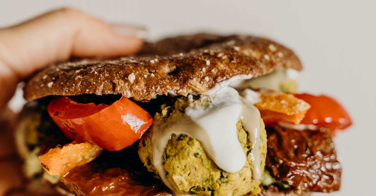 A colorful plate of vegan paella with vegetables and saffron-infused rice.