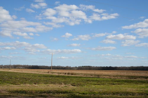 Kostenloses Stock Foto zu bauernhöfe, blauer himmel, wolken