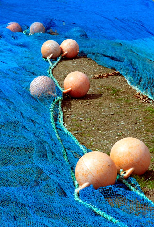 Fishing Net with Plastic Fishing Floats on the Ground