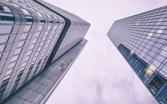 Low angle view of Silberturm and another skyscraper in Frankfurt showcasing modern architecture.