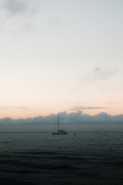Sailboat on the Sea Under White Sky
