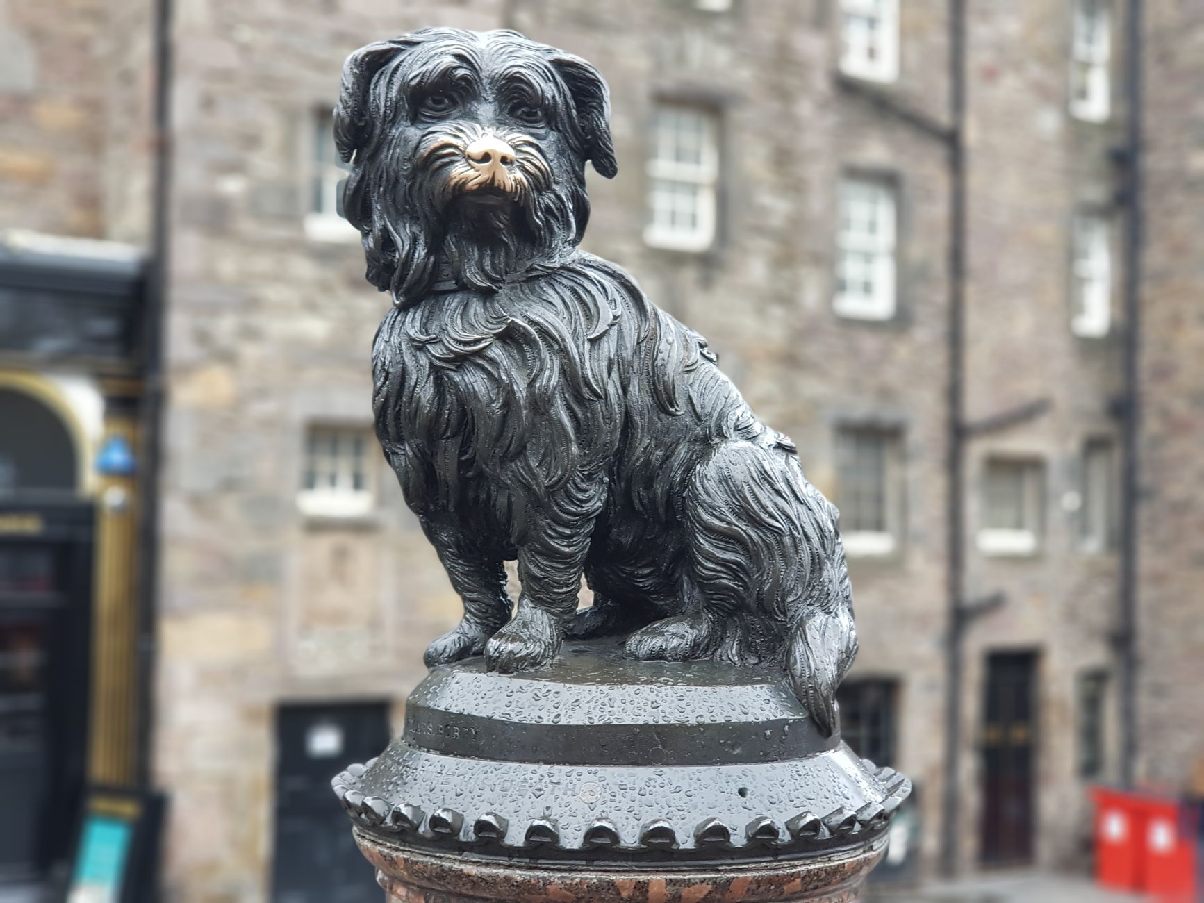 Famous Greyfriars Bobby statue in Edinburgh, Scotland, representing loyalty and devotion.