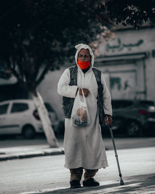 Old Man walking with a Cane 
