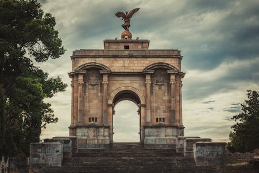 Majestic war memorial arch with eagle sculpture in Constantine, Algeria.