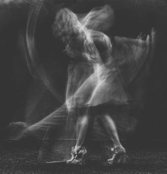 Black and white abstract image capturing a dancer's motion blur in Kyiv.